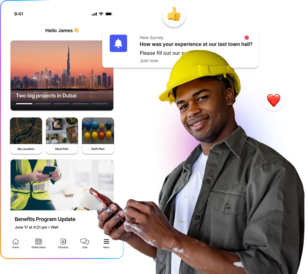 A man in a yellow hard hat smiles while holding a phone. A mobile app with updates and surveys is displayed beside him.